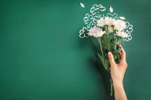 Teacher's day greeting card on green blackboard background. Copy space.