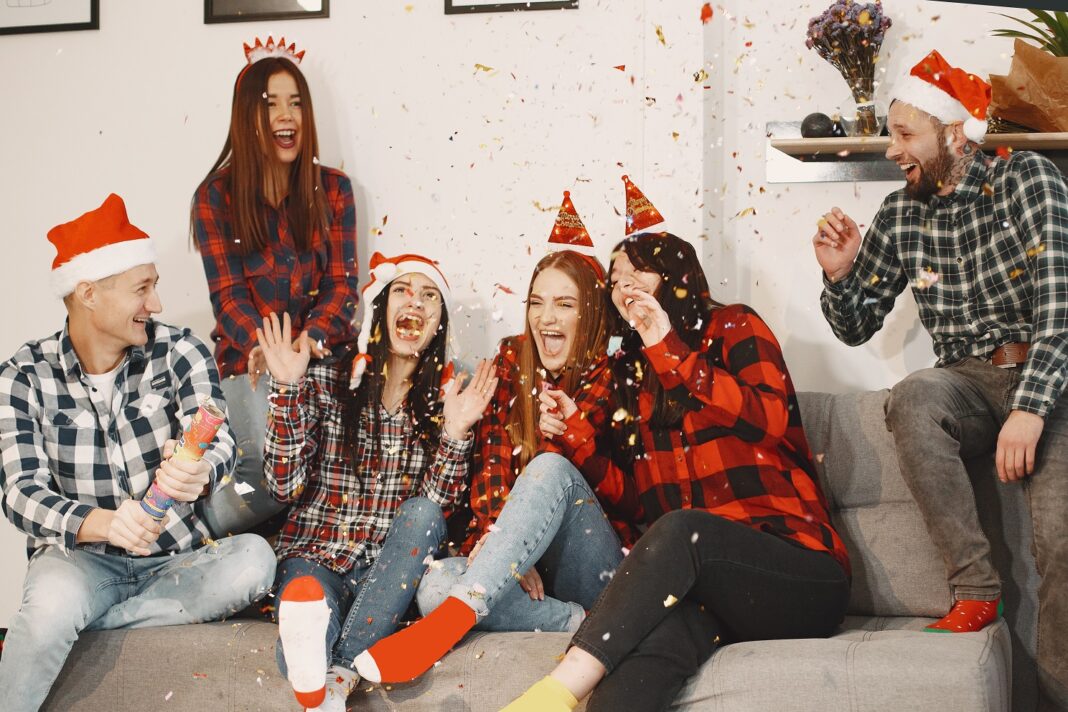 Young people celebrating New Year at home party