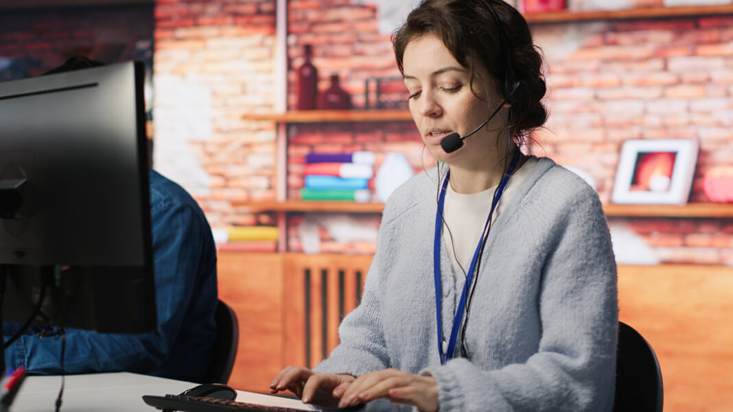 Call center employee handling customer complaints, offering helpful solutions